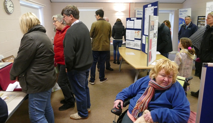 People looking at the slide shows and display boards